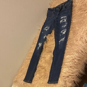 #164 American Eagle size 4,  Distressed Blue Jeans